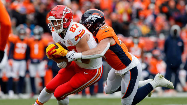 Oct 29, 2023; Denver, Colorado, USA; Kansas City Chiefs tight end Travis Kelce (87) is tackled by Denver Broncos linebacker Josey Jewell (47) in the first quarter at Empower Field at Mile High. Mandatory Credit: Isaiah J. Downing-USA TODAY Sports  